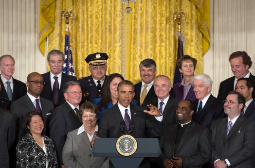 President Barack Obama (center) delivers remarks during an event in support of the Senate's bipartisan immigration reform bill at the White House in Washington, D.C., June 11, 2013.